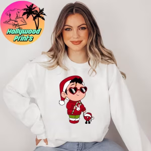 Woman with highlights wearing a white Baby Benito Christmas Sweatshirt, showcasing the design in a cozy holiday setting.