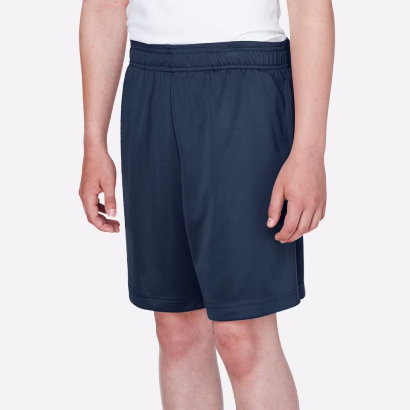 Team 365 youth performance shorts side view in navy color showing team fit and seven-inch inseam