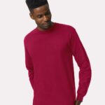 Man wearing a cardinal red Gildan ultra cotton long sleeve t-shirt.