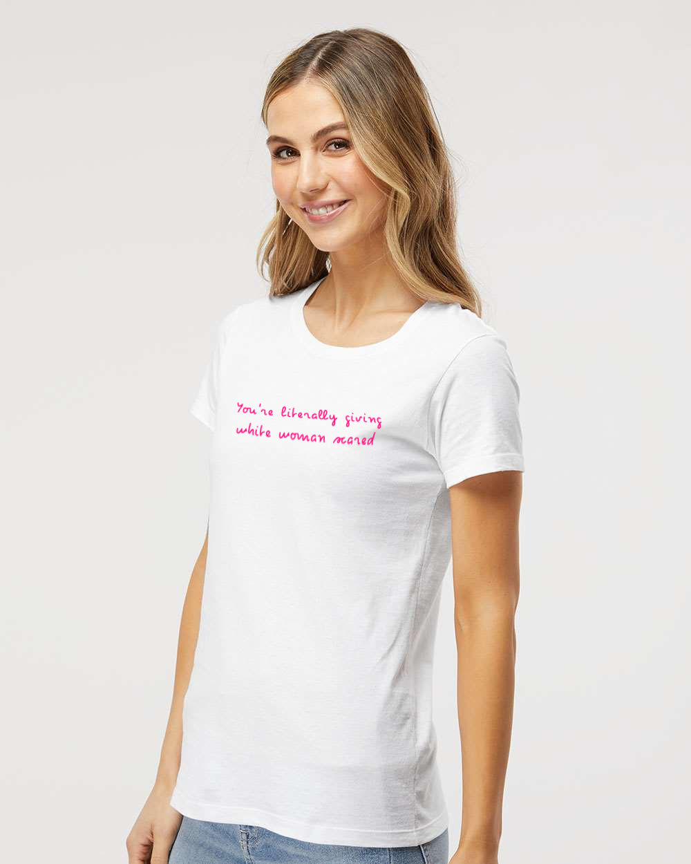 Woman standing sideways wearing funny white woman scared tee.