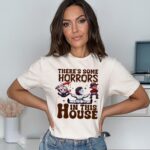 Woman wearing a there's some horrors in this house funny halloween white shirt made by Hollywood Prints
