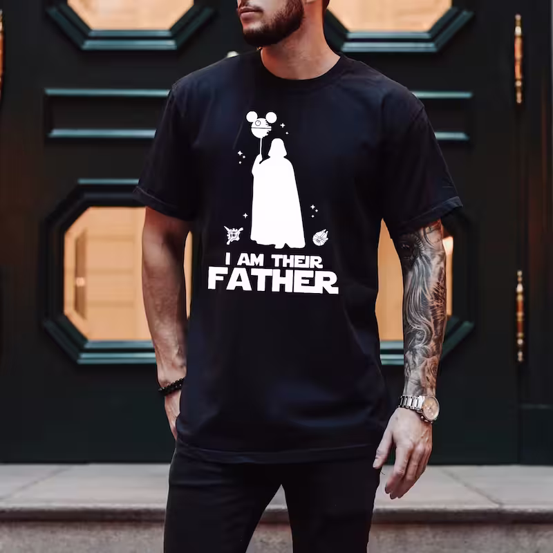 Man wearing an I Am Their Father Shirt in black color variant